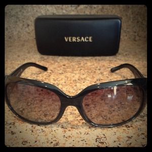 Versace black sunglasses with hard case. Versace black sunglasses with hard case.