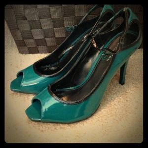 Real and black heels with an ankle strap. Real and black heels with an ankle strap.