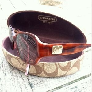 Tortoise frame, pink inside with brown Coach logo. Tortoise frame, pink inside with brown Coach logo.