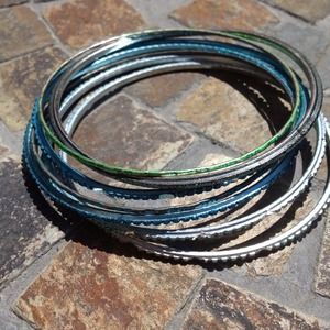 6 blue 1 green bracelets. 6 blue 1 green bracelets.