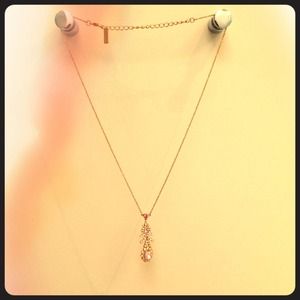 Gold necklace with charm Gold necklace with charm