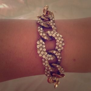 Gold link bracelet with rhinestone pave links. Gold link bracelet with rhinestone pave links.