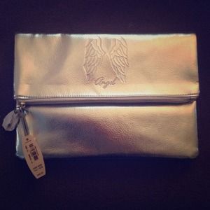 NWT Victoria's Secret fold over silver clutch NWT Victoria's Secret fold over silver clutch