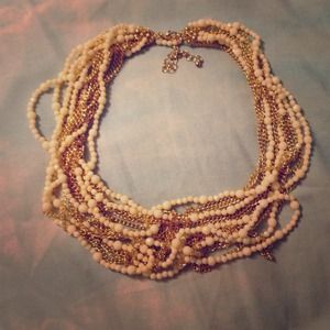 Gold toned and white beaded statement necklace Gold toned and white beaded statement necklace