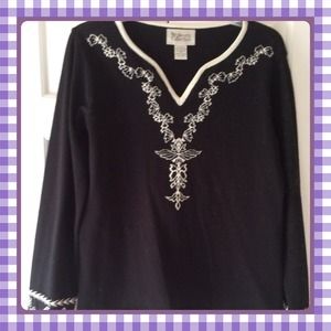 Black knit sweater with beautiful detail. Black knit sweater with beautiful detail.
