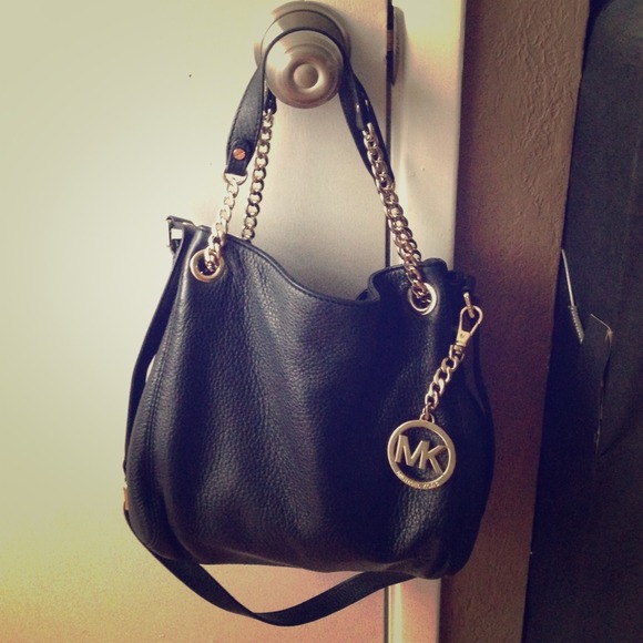 38% off Michael Kors Handbags - Michael Kors black leather purse with gold chain. from Rochelle ...