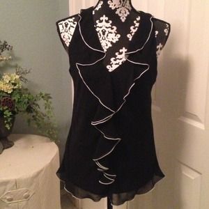 "NEW" pretty black w/white trim sleeveless top. "NEW" pretty black w/white trim sleeveless top.