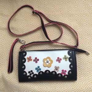 Black clutch/purse with studded flower detail Black clutch/purse with studded flower detail