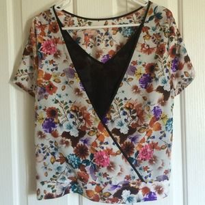 Floral top with cut outs in the back Floral top with cut outs in the back