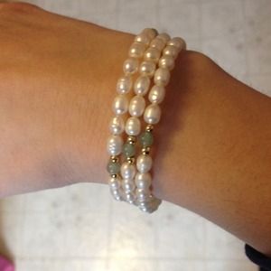 White pearls with green stones White pearls with green stones