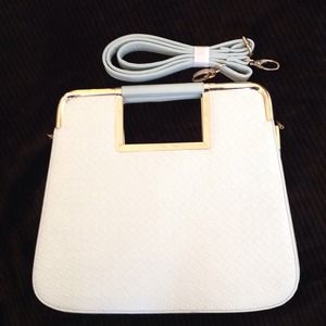 White and gold texted clutch White and gold texted clutch