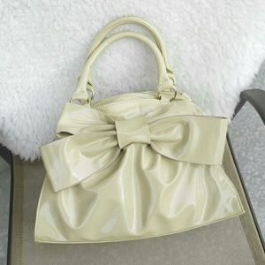 Shoedazzle Handbags - Faux patent bag with a bow. Shoedazzle Handbags - Faux patent bag with a bow.