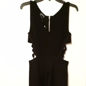 Black fitted bebe dress w/ sides cut out. *NWT Black fitted bebe dress w/ sides cut out. *NWT