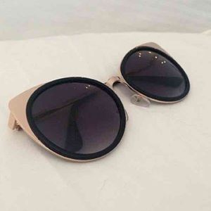 Black with gold frame sunglasses Black with gold frame sunglasses