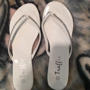 Traffic Shoes - White Flip Flops- never worn. Traffic Shoes - White Flip Flops- never worn.