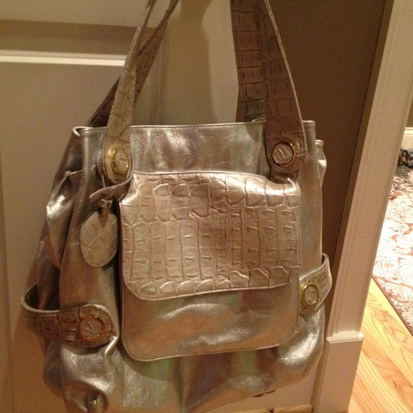 Large and roomy large silver tote with gold bling!