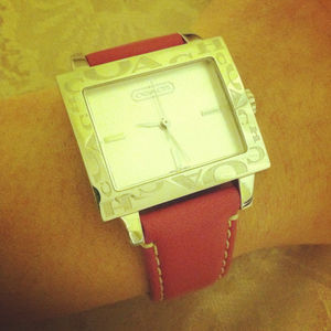 Pink leather watch by Coach.