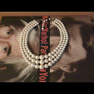 Three strand, varying length pearl necklace