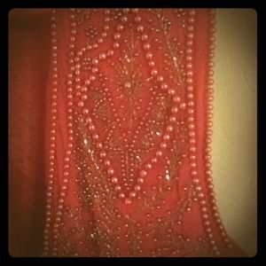 It's about the detail, beaded vest