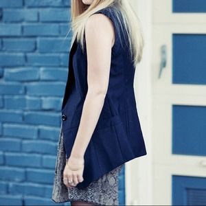 Blue, one button vet.