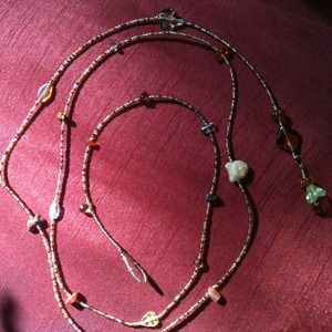 Lariat style necklace, belly wrap, belt.