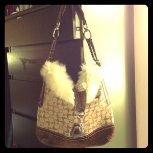 Reserved-- Coach like no other with fur