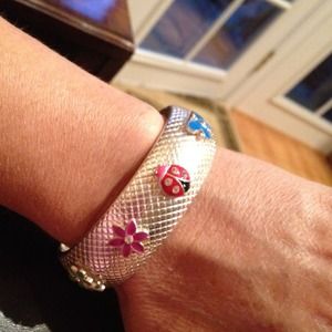 Silver bracelet with a flower, butterfly & ladybug