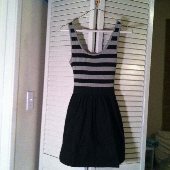 Black and grey striped dress with bow tie in back.