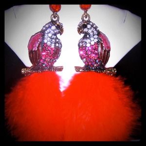 Red feather earrings.