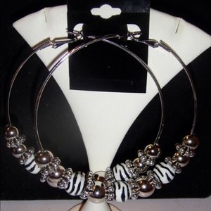 Hand-made zebra hoop earrings.