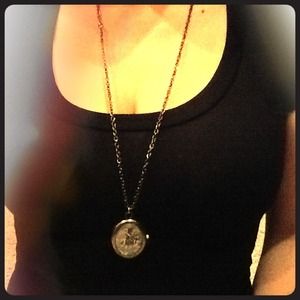 Long clock necklace.