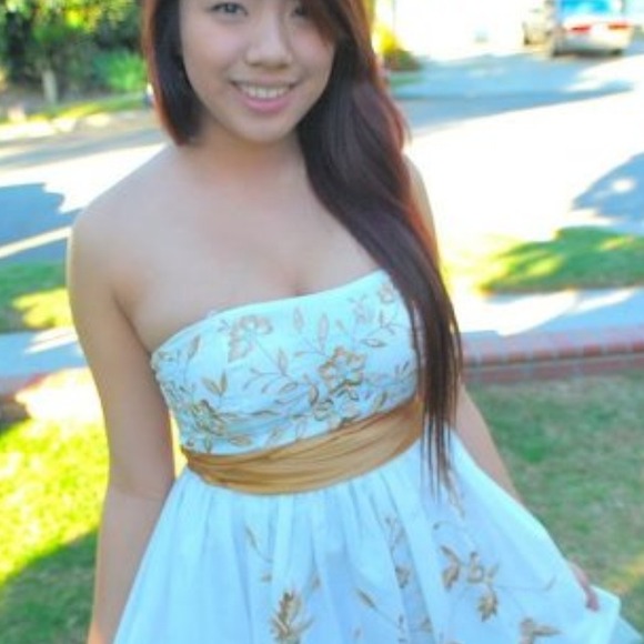 White dress w/ gold floral detail.