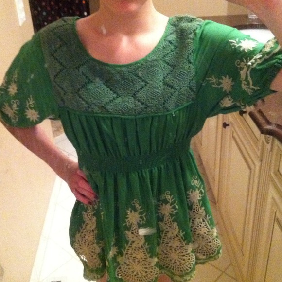 green shirt with white stitching