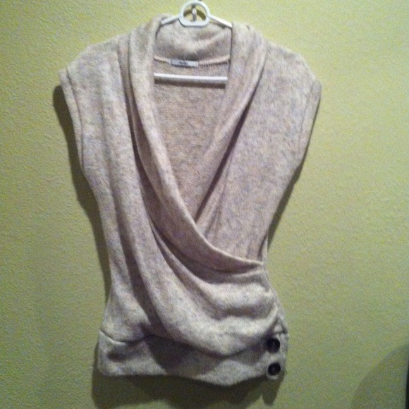 Cowl neck sleeveless sweater.