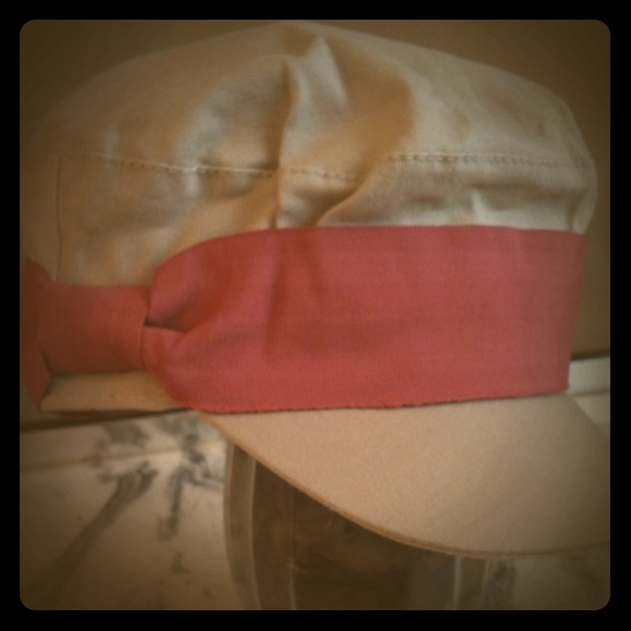 Tan hat with pink ribbon