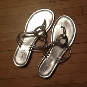 New silver flip flops