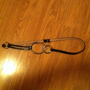 Faux snake skin belt with metal clasps.