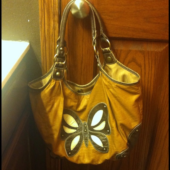 Brown leather purse with butterfly