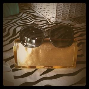 Tory Burch oversized sunglasses.