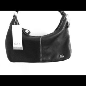 A brand new Sak, black leather handbag.