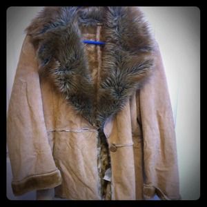 Fur coat. Never worn. Fur inside too.