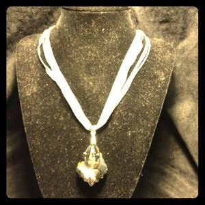 Silver necklace with silver glass pendant.