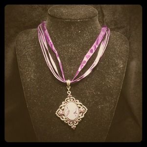 Purple cameo pendant on purple ribbon necklace