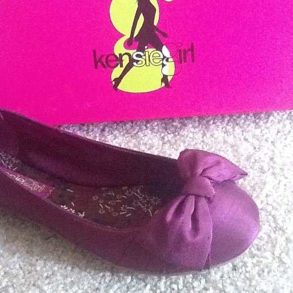New, in box.  Purple flats.