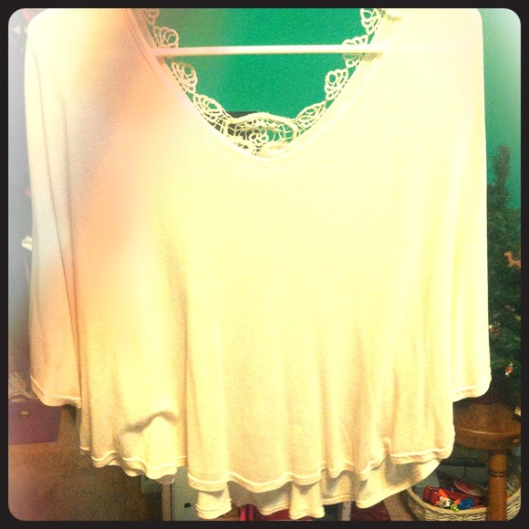 Flowing, light pink shirt with a slight open back