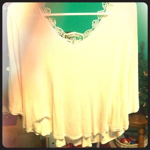 Flowing, light pink shirt with a slight open back