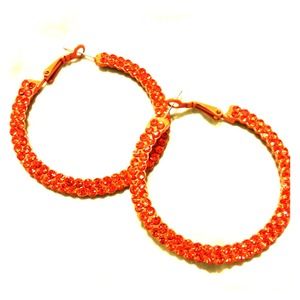 Sparkly orange hoop earrings