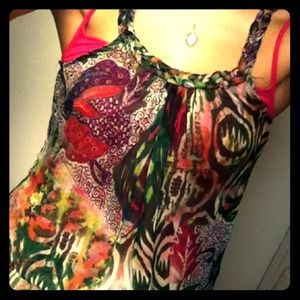 Green and pink sleeveless shirt.