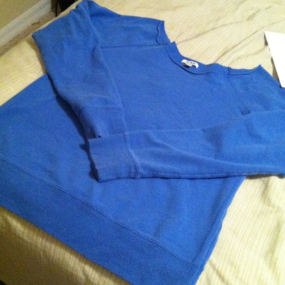 Off the shoulder blue sweater top.