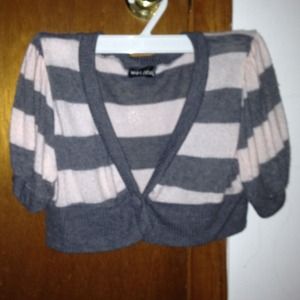 A  pink and gray striped short sleeve shawl.